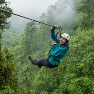 Traveler ziplining through Monteverde cloud forest