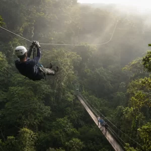 Traveler ziplining through Monteverde cloud forest